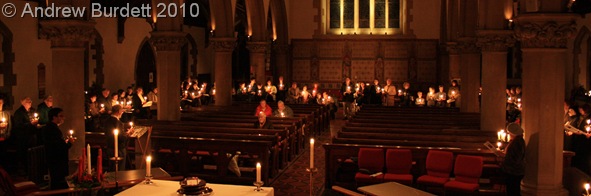 CHRISTINGLE CANDLELIGHT_With the church's lights dimmed, each Christingle shone bright.