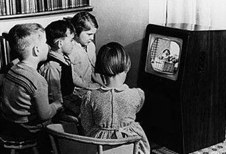 MONOCHROME BOX_Children watching Andy Pandy on a black and white TV.