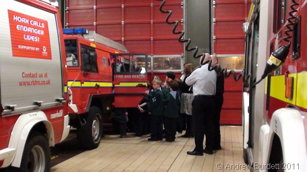 PILE 'EM IN_The Cubs squeeze into the 6*6 all-terrain mini-fire-engine.