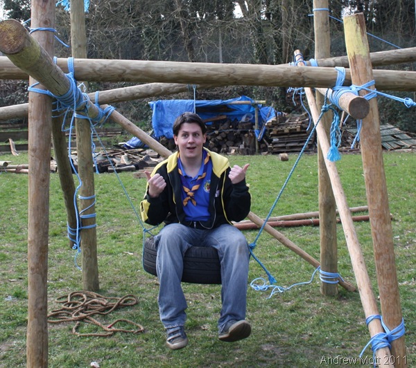 THUMBS UP_Leader Damien Woodall poses on the swing-type throne.