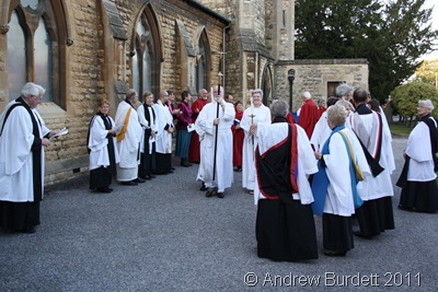 GET READY_Clergy, the choir, and servers ready to enter in procession.