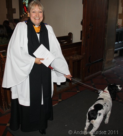 LADY'S BEST FRIEND_Sally with her dog at the door, just after the service.