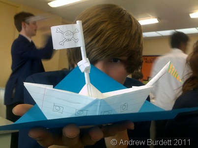Zac Brooke holds an origami boat he made in a science lesson, after the batch of exams in May 2011