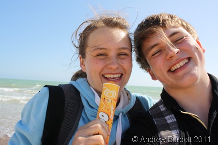 COOL KIDS_Harriet and me on the beach; H with a lolly, A with a chocolate messy upper-lip.
