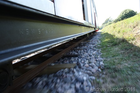 TRAIN TRAVEL_The miniature railway speeding away.