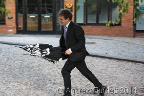 QUICK_Matthew returns brollies to guests who'd forgotten them. (1 of 4)
