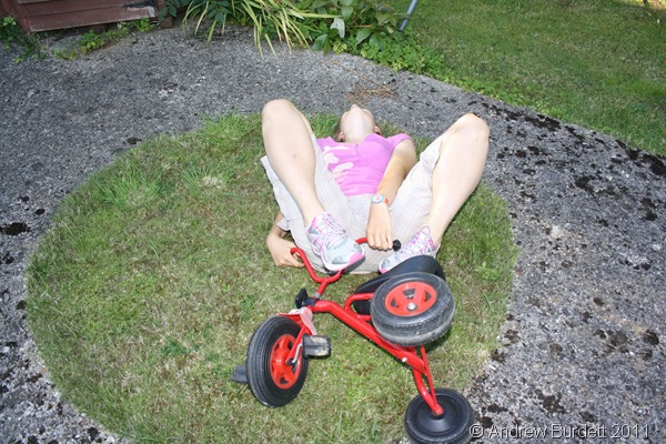 SPIN-OUT_Harriet fell off the trike on the grassy path in the middle of the 'roundabout'.