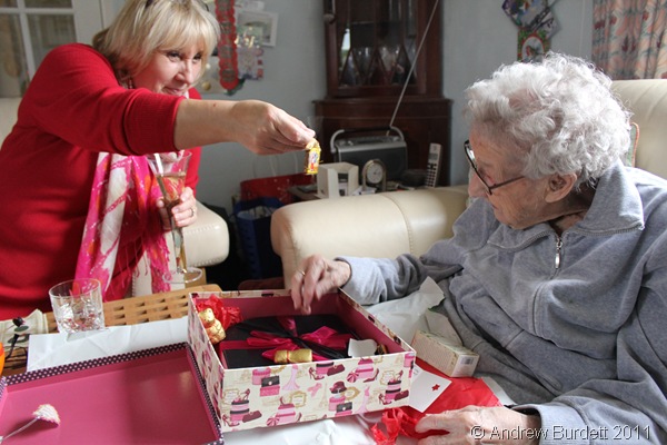 HELPING HAND_Kate (Dorothy's daughter) helped her mother unwrap her Christmas parcel from us.