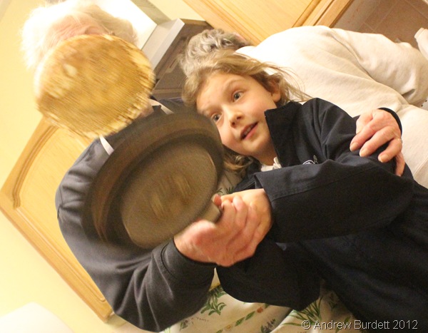 CAREFUL: A schoolgirl tosses a pancake. (IMG_8327)