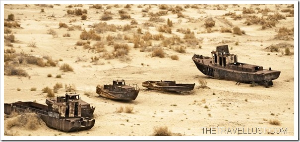 DESERT ISLAND SHIPS: Boats lay wrecked in a sea of sand.