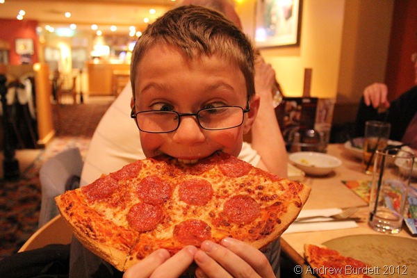 BITING OFF MORE HE CAN CHEW: A younger Sparkler enjoys a giant pizza at Pizza Hut. (IMG_1262)