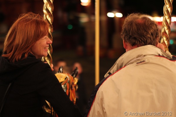 SENIOR MOMENT: An older couple take a ride on the Carters Gallopers, hand in hand. (IMG_2825)