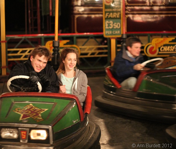 TAKING HER FOR A RIDE: Year 10 girl Georgia Austin joined me on the dodgems, while my father put on a more serious face in his dodgem car. (IMG_2844)