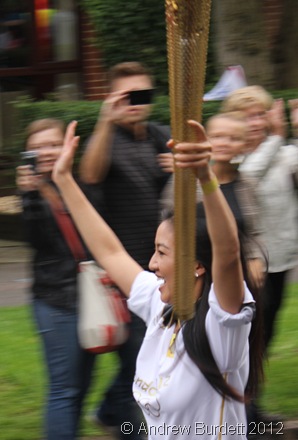 ARMS IN THE AIR LIKE SHE JUST DON'T CARE: Torchbearer Number 130 runs through Oxford yesterday, in the final leg of its Luton to Oxford journey. (IMG_8533)
