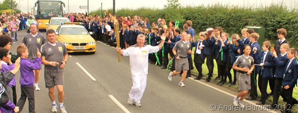 HERE IT IS: Furze Platt Senior School pupils lined the banks of the road to watch as the Torch passed the school. (IMG_8810_ARB-edited)