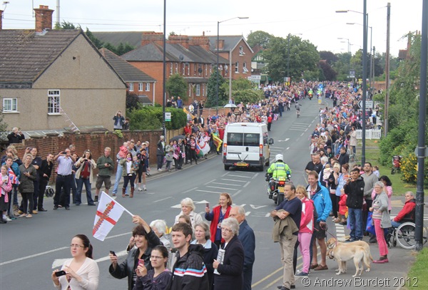 LINING THE ROUTE: Thousands of people descended on the the road to see the Torch pass. (IMG_8824_ARB)