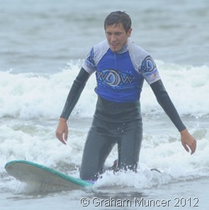 KNEELER: Assistant Leader Alex rode a wave. (0563_20120808_DSC3362_GrahamMuncer)