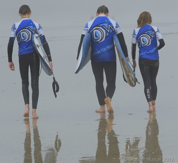 INTO THE MIST: Josh, me, and Madi walk up the foggy beach with our boards. Actually, Madi made me carry hers for her, though she helpfully volunteered to 'lug' the strap. (0778_20120808_DSC3574_GrahamMuncer)