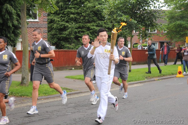 RELAY RUNNER: Torchbearer 132 running with the Flame. (IMG_8567/OXFORD)