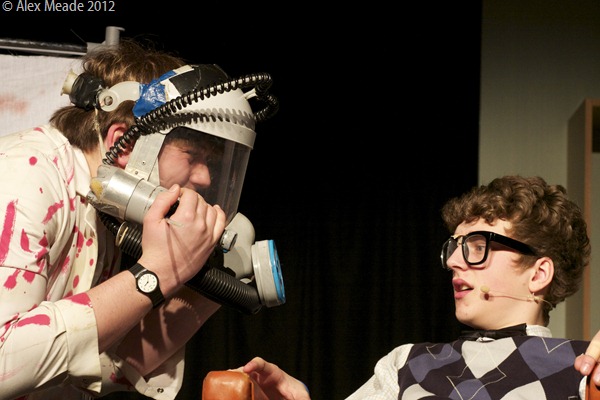 IT'S STUCK: Me, left, as Orin, asking my dental patient, Seymour, for help with removing my laughing gas mask. (IMG_3718_AlexMeade)