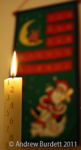 COUNTING DOWN TO CHRISTMAS: Our 2011 Advent candle shines bright. (IMG_6151)