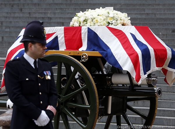 ROLLING BY: The gun-carriage carrying Thatcher's coffin is processed through London.