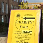 Sign pointing to the Lions Club's Charity Fair in Maidenhead Town Hall.