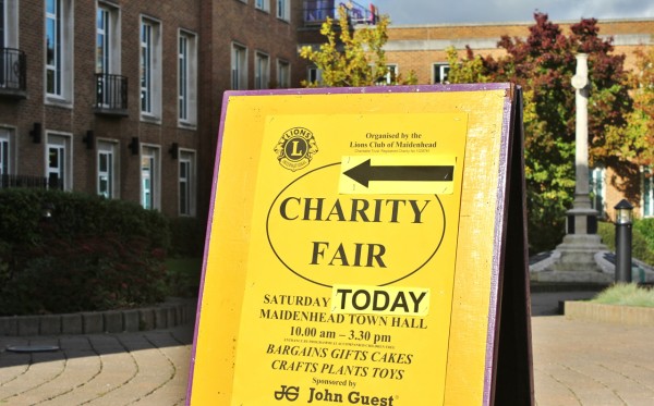Sign pointing to the Lions Club's Charity Fair in Maidenhead Town Hall.
