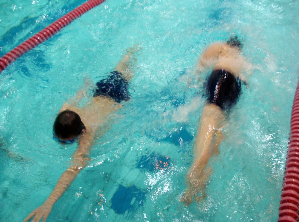 As one St Luke's swimmer completes a two-length 'lap', another sets off.