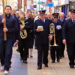 Walking up Maidenhead High Street, the Salvation Army lead the Walk of Witness procession.