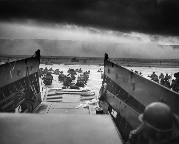 A photo taken from a landing craft on the morning of D-Day, as troops were delivered to their deaths.