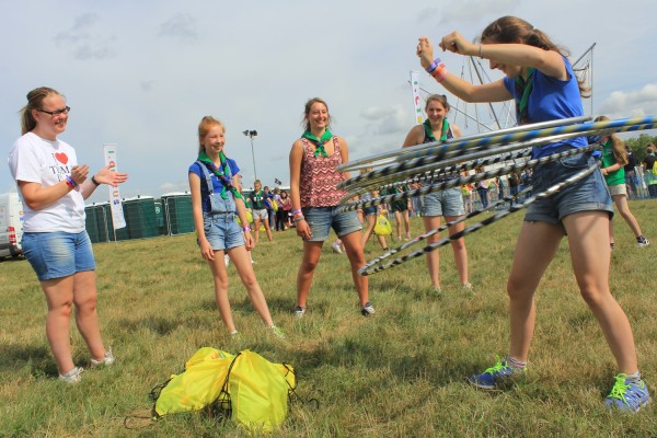 Guides from the East Lothian group wiggle hula hoops.