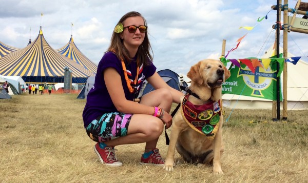 Henri, 16, with hearing dog Odi - who has her own neckerchief.