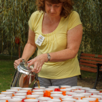 Phyl Sopp begins pouring tea for the thirsty pilgrims.