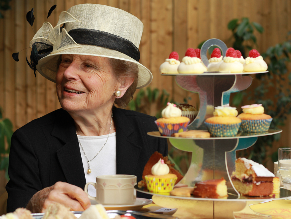 Ann Hockham enjoying the pleasant atmosphere of the vicarage garden party in August 2014.