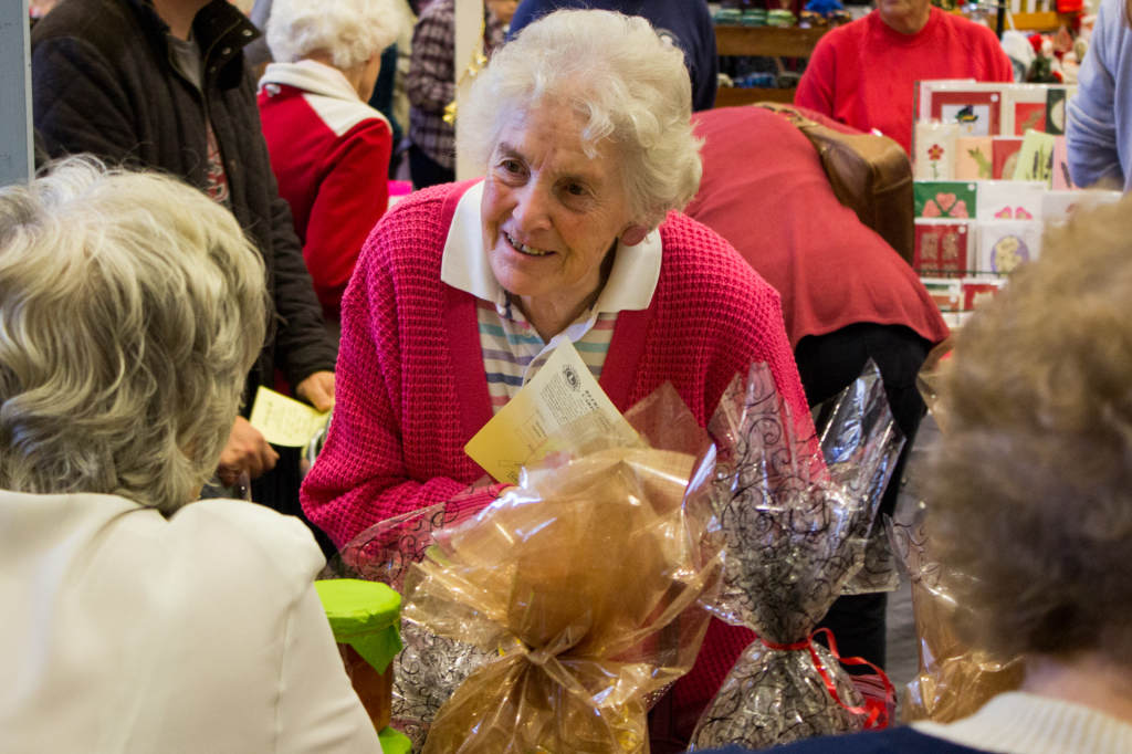 Enid Barber, a St Luke's congregation member, catches up with one of the ladies on the church's stall.