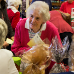 Enid Barber, a St Luke's congregation member, catches up with one of the ladies on the church's stall.