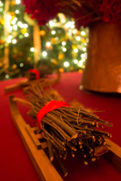 Twigs, bundled like logs on a miniature sledge, decorate a table in one of the rooms at Waddesdon.