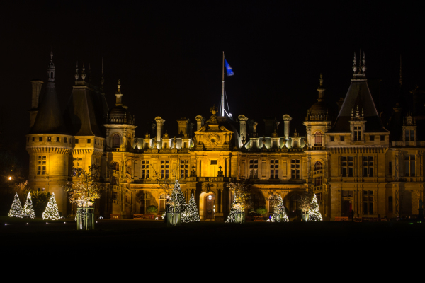 Seen here from an angle, the facade at Waddesdon is particularly impressive by night.