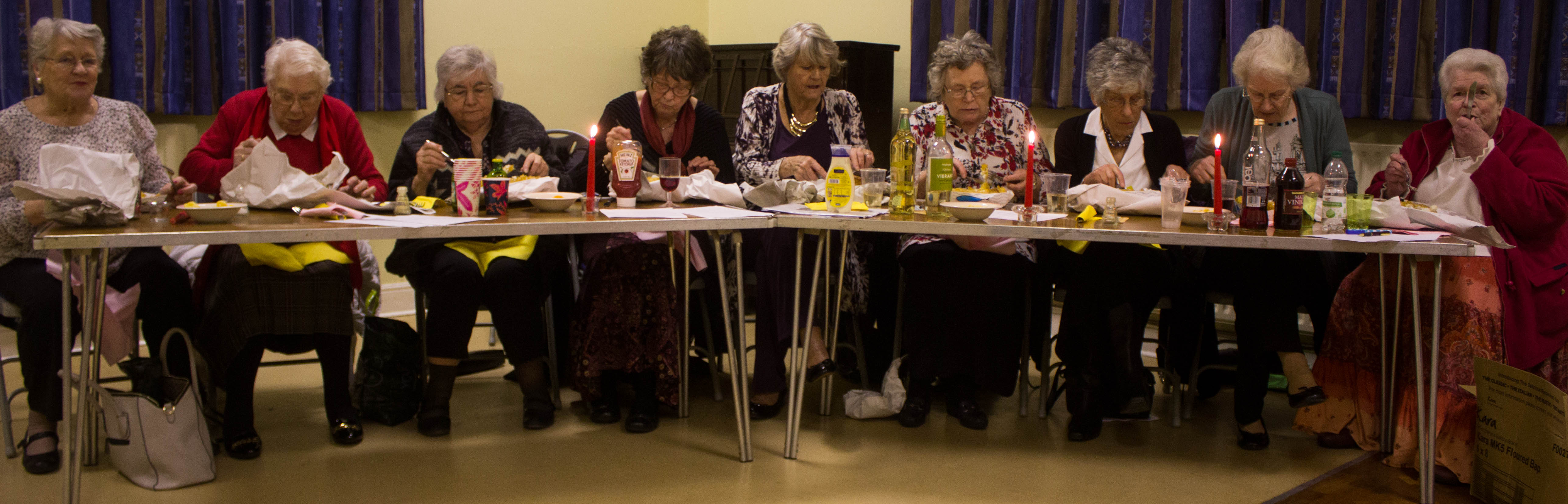 Some of the ladies of St Luke's enjoying their fish-and-chip suppers.
