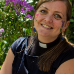 Nicola Hulks, the newly-installed St Luke's curate, had a floral design applied on Ruth Baughan's face-painting stall.