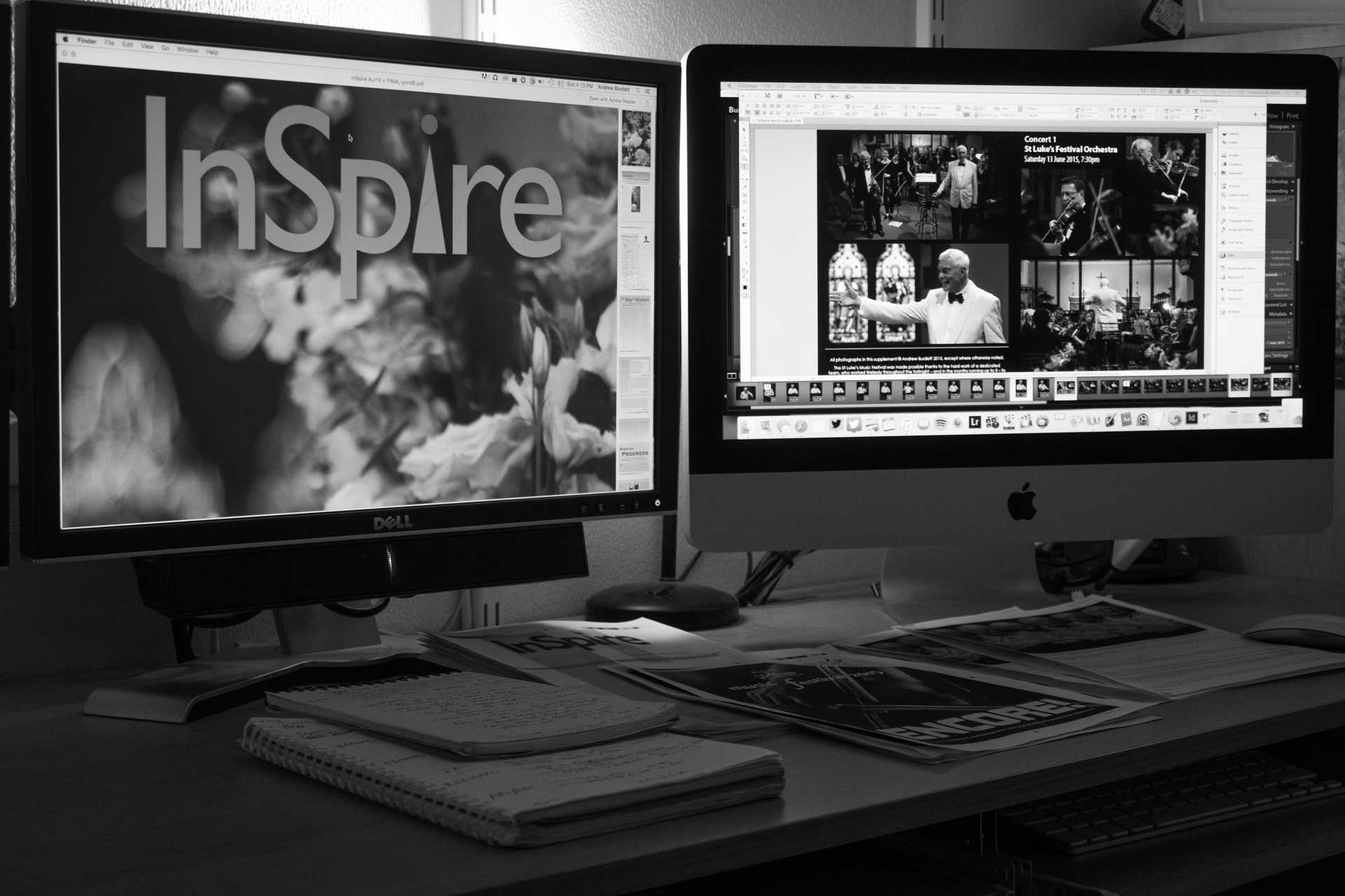 Andrew Burdett's desk with computers displaying an early edition of the Autumn 2015 edition of InSpire.