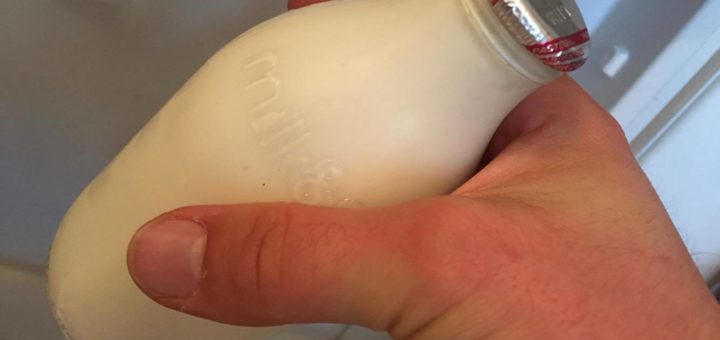 An errant hand thieves a pint of milk.